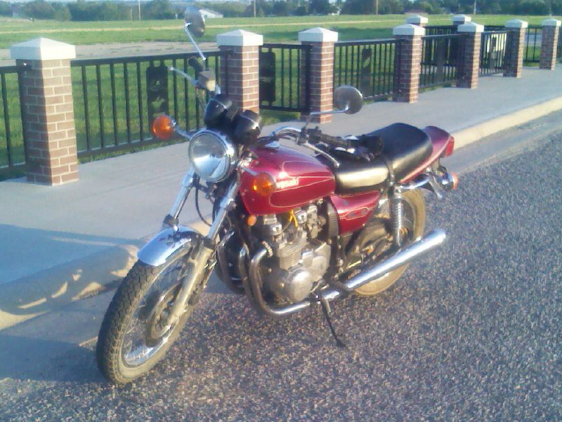 1979 Kawasaki KZ650 motorcycle in burgundy livery parked at the Marysville, KS airport, front view