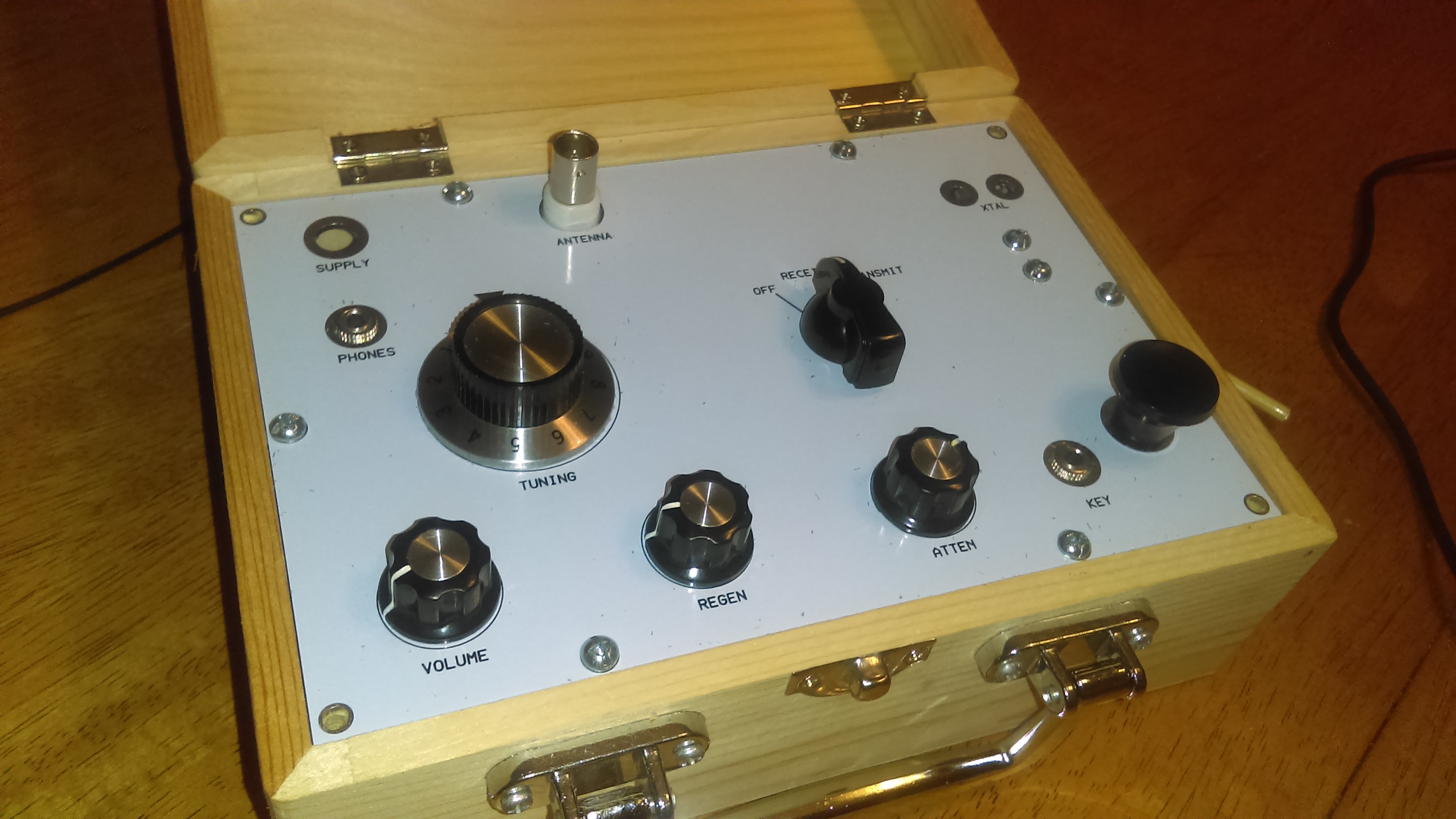 4 State QRP Group original Bayou Jumper kit shown in wooden enclosure.